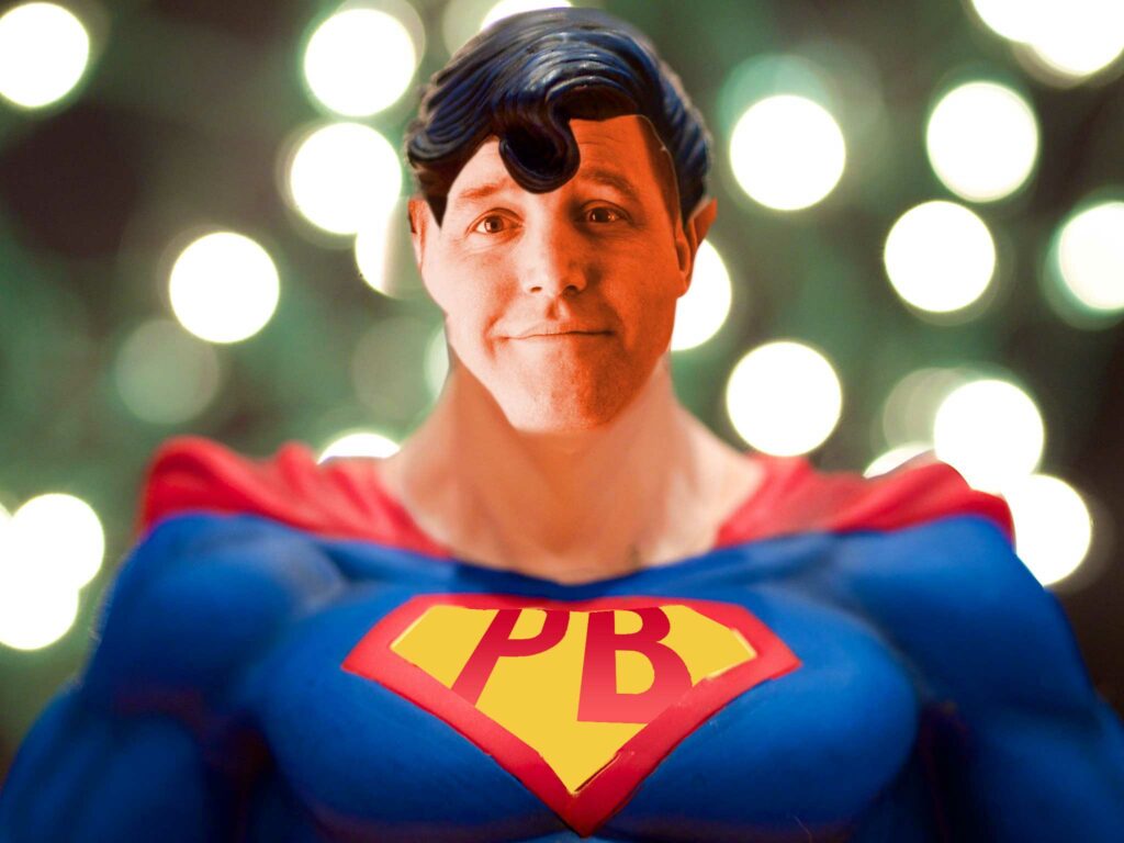 A remix image of Superman aka Man of Steel with face replaced with a photo of Steel Wagstaff and the "S" logo changed to "PB"